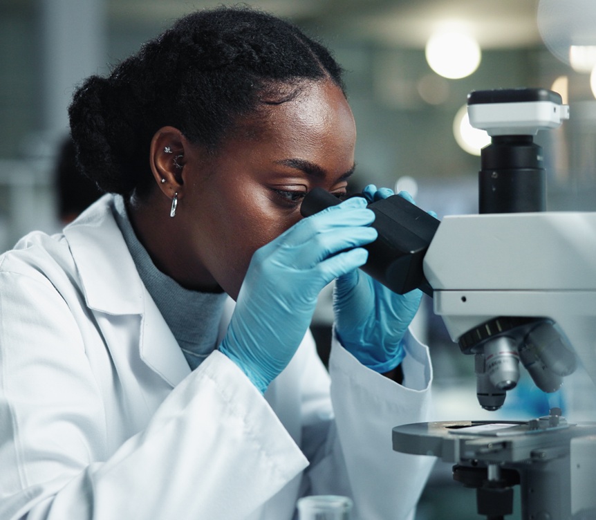 research student using microscope
